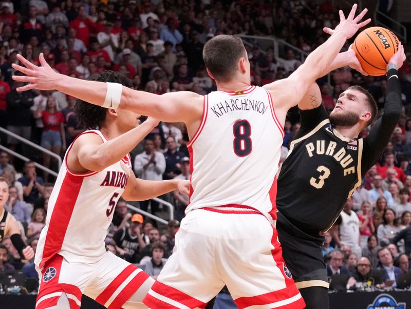 Purdue Boilermakers guard Braden Smith (3) looks to pass while being defended by Arizona Wildcats guard Brayden Burries (5) and forward Ivan Kharchenkov (8) during a NCAA Tournament game Saturday, March 28, 2026 at SAP Center in San Jose, Calif. Purdue fell to Arizona 79-64.