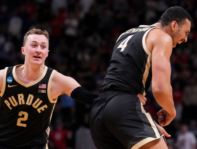 Purdue Boilermakers guard Fletcher Loyer (2) holds back forward Trey Kaufman-Renn (4) after a call from the referee during a NCAA Tournament game against the Arizona Wildcats on Saturday, March 28, 2026 at SAP Center in San Jose, Calif. Purdue fell to Arizona 79-64.