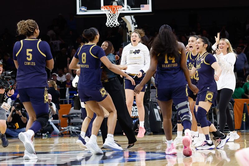 Mar 27, 2026; Fort Worth, TX, USA; Notre Dame Fighting Irish head coach Niele Ivey celebrates with her team after the Notre Dame Fighting Irish defeat he Vanderbilt Commodores at Dickies Arena. Mandatory Credit: Chris Jones-Imagn Images