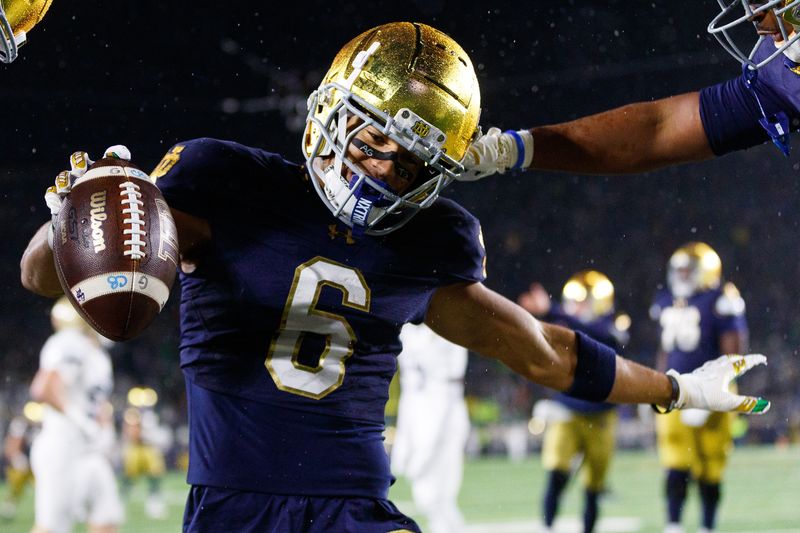 Notre Dame wide receiver Jordan Faison (6) celebrates after scoring a touchdown during the first half of a NCAA football game against Navy at Notre Dame Stadium on Saturday, Nov. 8, 2025, in South Bend.