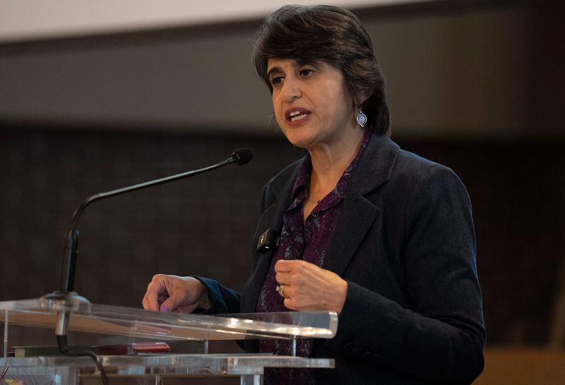 Carmel City Councilwoman Anita Joshi, MD speaks Monday, March 30, 2026, during a town hall meeting for residents to voice their opposition to the planned ICE office at Carmel Friends Church in Carmel.