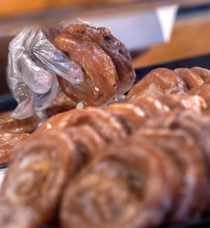 A customer’s order of donuts is filled at Long’s Bakery Tuesday, March 31, 2026. The city is planning to close the 16th Street Bridge, by the bakery, for two years starting June 1, 2026, for repairs. Even though residents know the repairs are needed, they feel it will be detrimental to the movement of the people in and out of the west end. Businesses, led by Long’s Bakery, are advocating for a partial closure rather than a full closure.