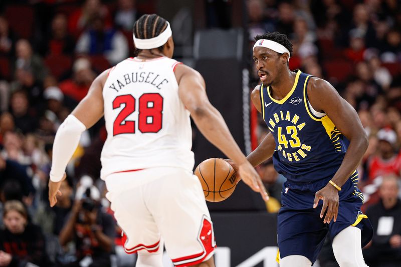 Apr 1, 2026; Chicago, Illinois, USA; Indiana Pacers forward Pascal Siakam (43) brings the ball up court against Chicago Bulls forward Guerschon Yabusele (28) during the first half at United Center. Mandatory Credit: Kamil Krzaczynski-Imagn Images