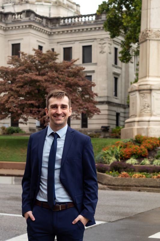 Tanner Dale Branham poses in front of the Monroe County Courthouse on Sunday, Oct. 19, 2025.