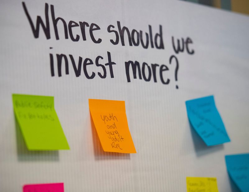 Community members write down areas they feel the city could invest in more during a Community Budget Forum at McCollough Library in Evansville, Ind., Thursday, April 3, 2026.