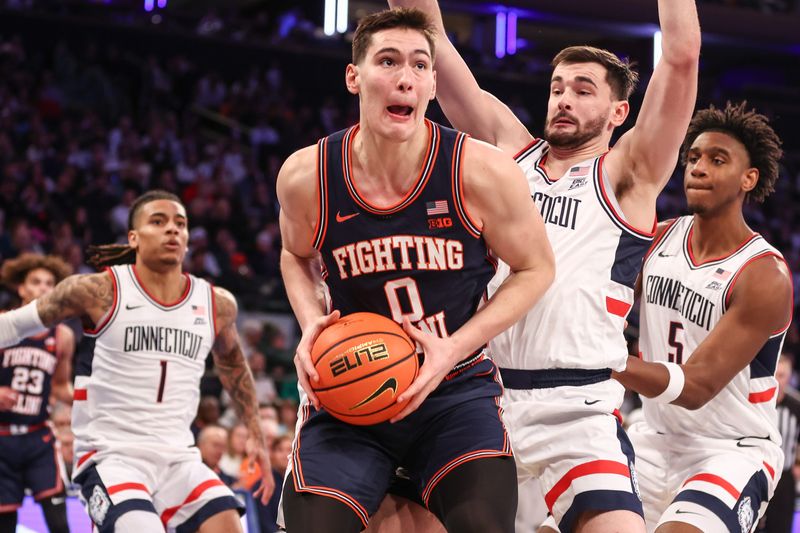 Nov 28, 2025; New York, New York, USA; Illinois Fighting Illini forward David Mirkovic (0) comes down with a rebound in the second half against the UConn Huskies at Madison Square Garden. Mandatory Credit: Wendell Cruz-Imagn Images