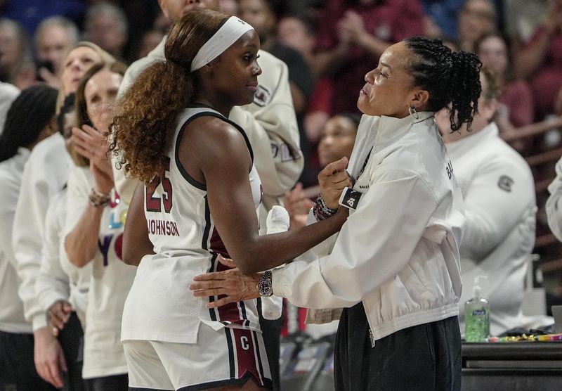 South Carolina Coach Dawn Staley greets South Carolina guard Raven Johnson (25) coming out of the game against University of Southern California Monday, March 23, 2026, during the fourth quarter NCAA Women's Basketball Tournament at Colonial Life Arena in Columbia, South Carolina.
