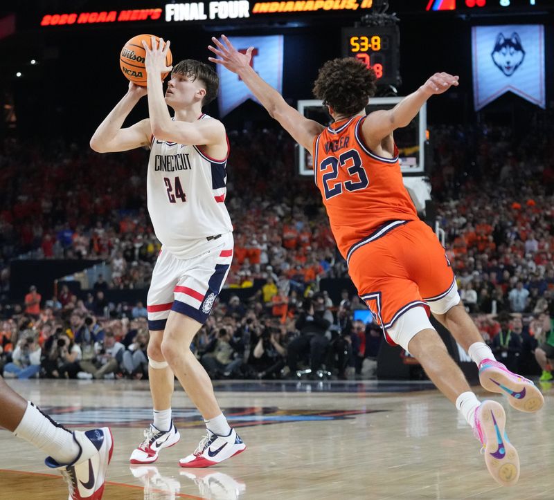 UConn Huskies guard Braylon Mullins (24) shoots and makes a three point basket Saturday, April 4, 2026, during a Final Four game against the Illinois Fighting Illini at Lucas Oil Stadium in Indianapolis.