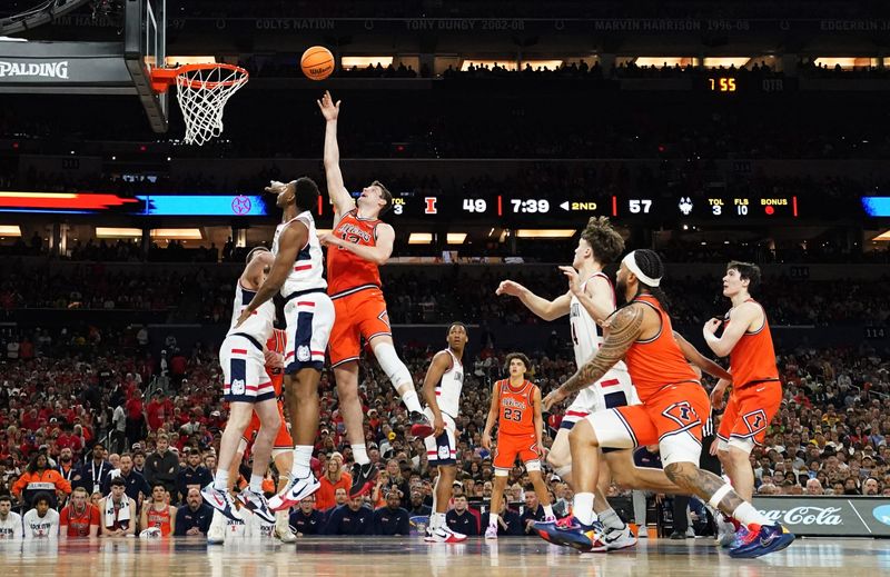 Illinois Fighting Illini center Tomislav Ivisic (13) gets the shot off Saturday, April 4, 2026, during a Final Four game against the UConn Huskies at Lucas Oil Stadium in Indianapolis.