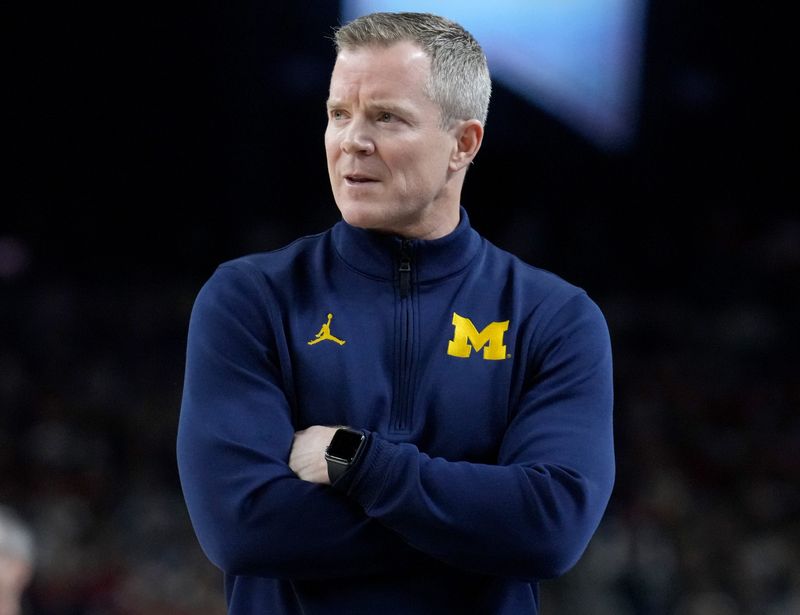 Michigan Wolverines head coach Dusty May watches Saturday, April 4, 2026, during a Final Four game against the Arizona Wildcats at Lucas Oil Stadium in Indianapolis.