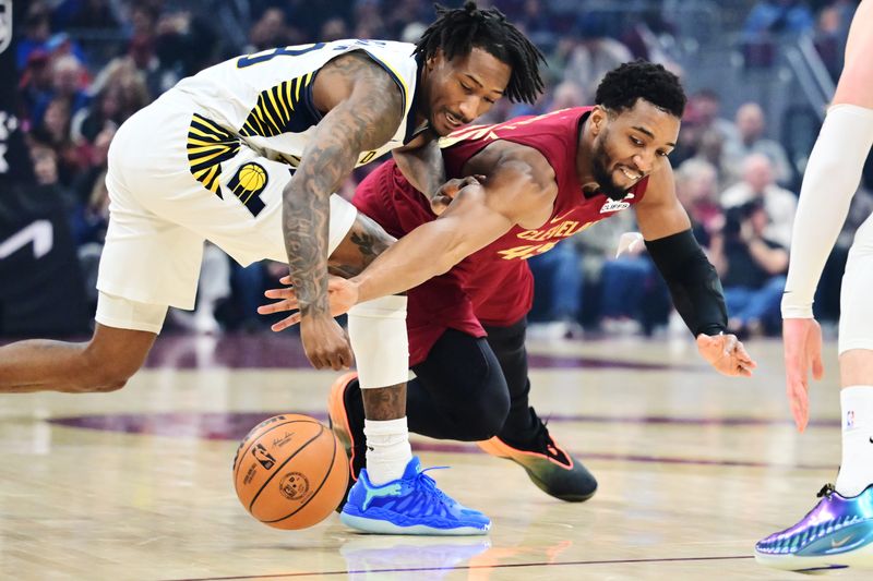 Apr 5, 2026; Cleveland, Ohio, USA; Cleveland Cavaliers guard Donovan Mitchell (45) goes for a loose ball against Indiana Pacers guard Quenton Jackson (29) during the first half at Rocket Arena. Mandatory Credit: Ken Blaze-Imagn Images