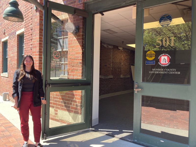 Monroe County Election Supervisor Kylie Farris stands at the entry door to the just-renovated Election Central office and voting space. The site at 501 N. Morton St. replaces the former NAPA auto parts store location.