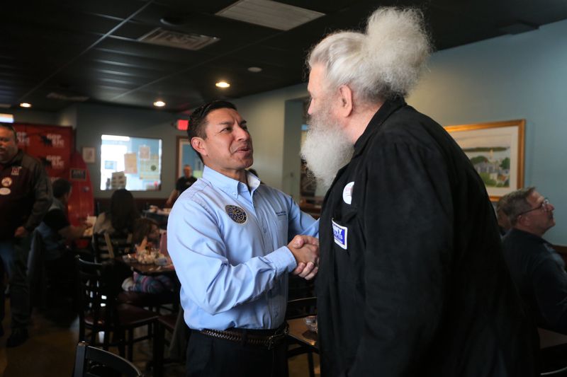 Indiana Secretary of State Diego Morales shakes Fred Jarnoik's hand at the St Joseph County Young Republicans Dyngus Day celebration April 6, 2026, at Allie’s Café in South Bend.