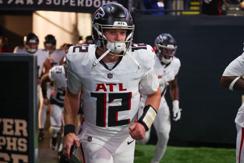 Nov 23, 2025; New Orleans, Louisiana, USA; Atlanta Falcons quarterback Easton Stick (12) takes the field prior to a game against the New Orleans Saints at Caesars Superdome. Mandatory Credit: Stephen Lew-Imagn Images