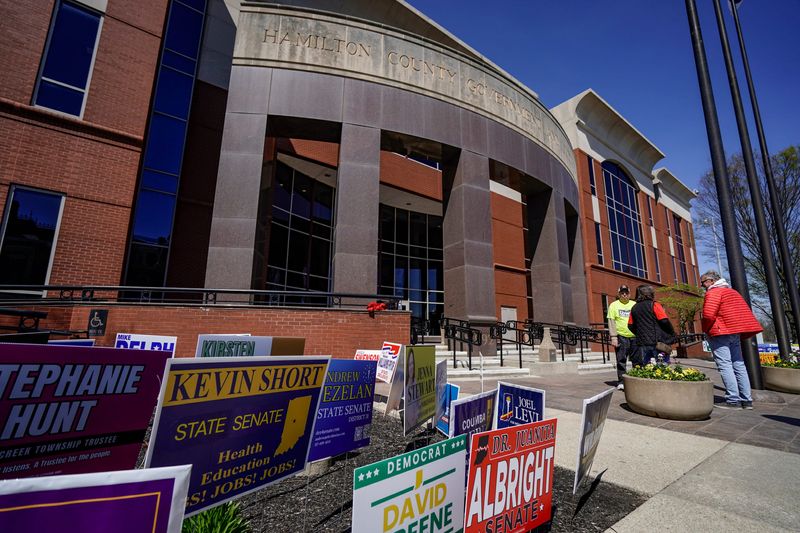 Campaign signs are posted outside the Hamilton County Government and Judicial Center on Wednesday, April 8, 2026, for early voting in Noblesville, Indiana.