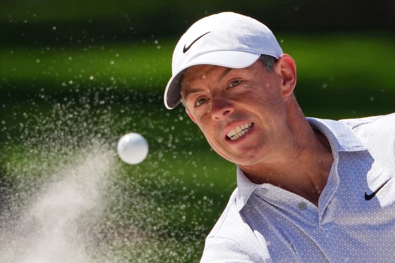 Rory McIlroy plays a shot from a bunker on the seventh hole during the second round of the 2026 Masters Tournament at Augusta National Golf Club.