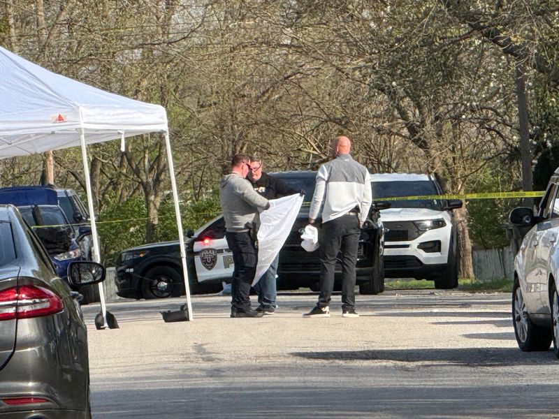 Police clean up a crime scene in the 2200 block of Stillwell Street in Lafayette, where a man was shot and killed by police after allegedly brandished a weapon.