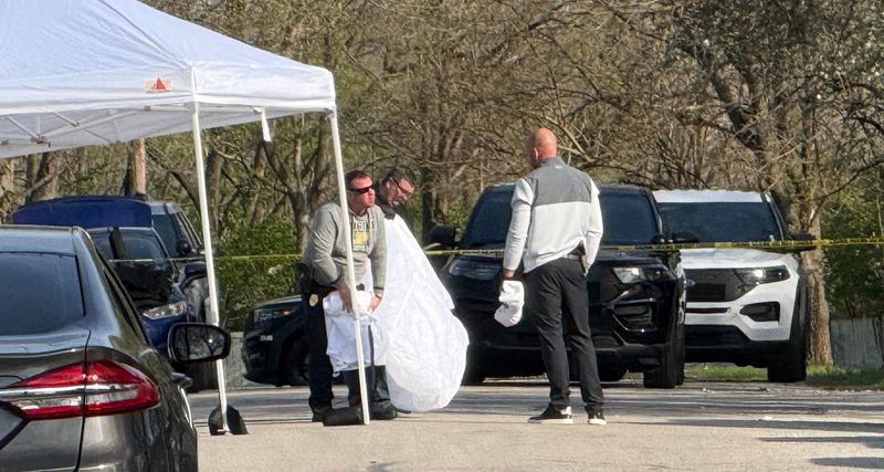Police clean up a crime scene in the 2200 block of Stillwell Street in Lafayette, where a man was shot and killed by police after allegedly brandished a weapon.