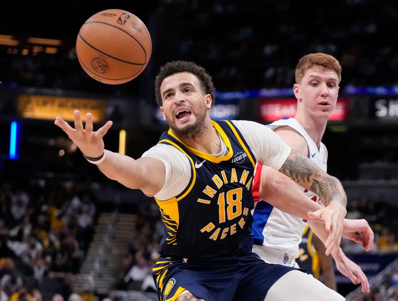 Indiana Pacers forward Jalen Slawson (18) reaches for the ball Sunday, April 12, 2026, during the game at Gainbridge Fieldhouse in Indianapolis.