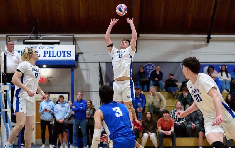 Bethel University junior setter McGwire Eigenrauch (12) passes the ball during a play for the men's volleyball team during the 2026 season.