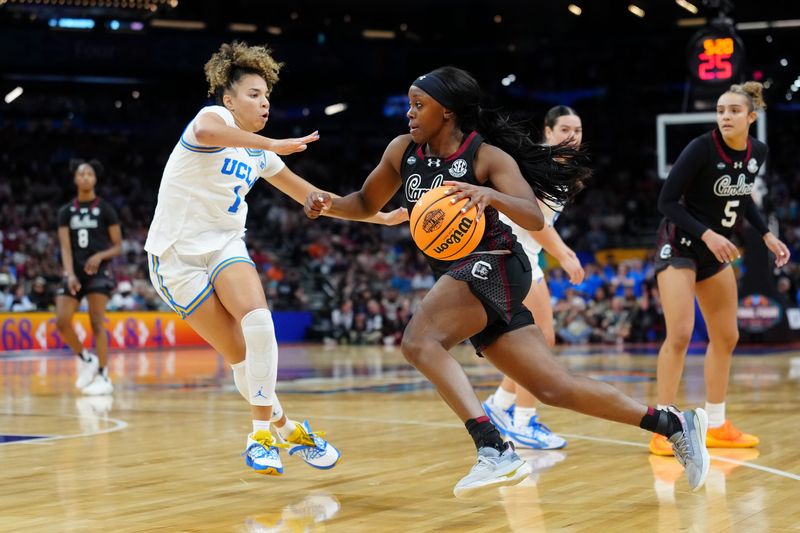 Apr 5, 2026; Phoenix, AZ, USA; South Carolina Gamecocks guard Raven Johnson (25) controls the ball against UCLA Bruins guard Kiki Rice (1) in the second half during the National Championship game of the women's 2026 NCAA Tournament at Mortgage Matchup Center. Mandatory Credit: Kirby Lee-Imagn Images