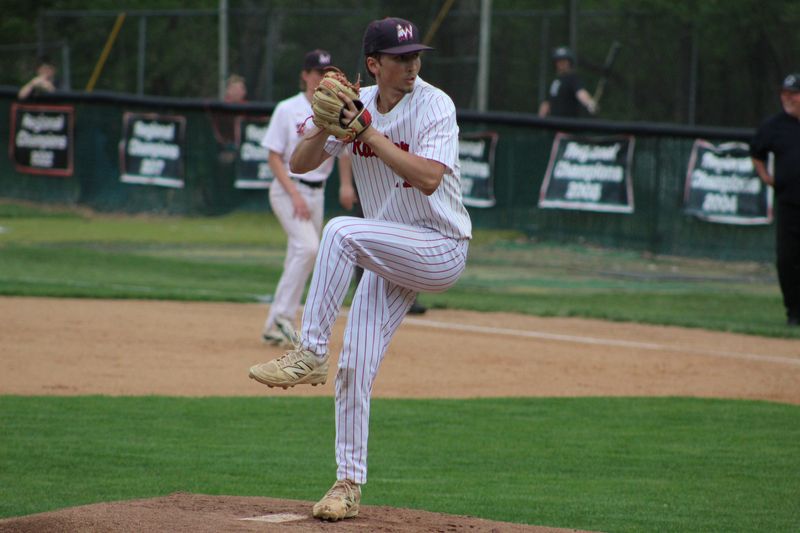 Wapahani baseball senior Brandt Longfellow winds up a pitch during the Raiders 5-4 win over Eastbrook at Wapahani High School on Tuesday, April 14, 2026.