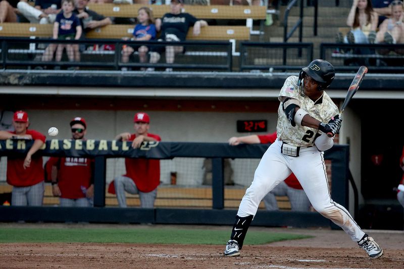 Purdue fifth year infielder CJ Richmond swings for the ball on Tuesday, April 14, 2026, at Alexander Field in West Lafayette, Ind.