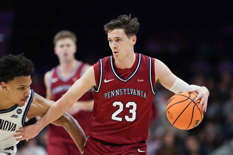 Dec 6, 2025; Philadelphia, PA, USA; Penn Quakers forward Ethan Roberts (23) dribbles the ball against the Villanova Wildcats during the first half at Xfinity Mobile Arena. Mandatory Credit: Bill Streicher-Imagn Images