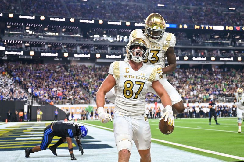 Oct 8, 2022; Paradise, Nevada, USA; Notre Dame Fighting Irish TE Michael Mayer (87) celebrates with wide receiver Jayden Thomas (83) after a touchdown in the third quarter against the BYU Cougars at Allegiant Stadium. Mandatory Credit: Matt Cashore-USA TODAY Sports