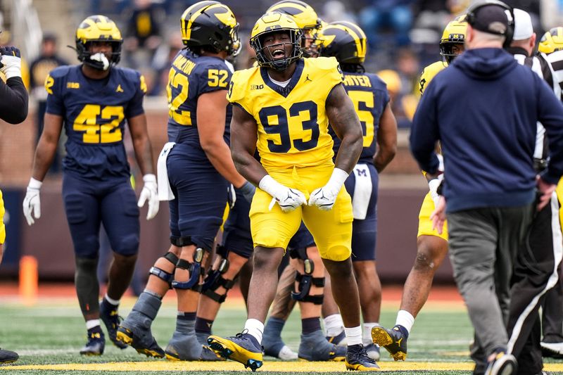 Team Maize defensive lineman Benny Patterson (93) celebrates a play against Team Blue during the spring game at Michigan Stadium in Ann Arbor on Saturday, April 18, 2026.