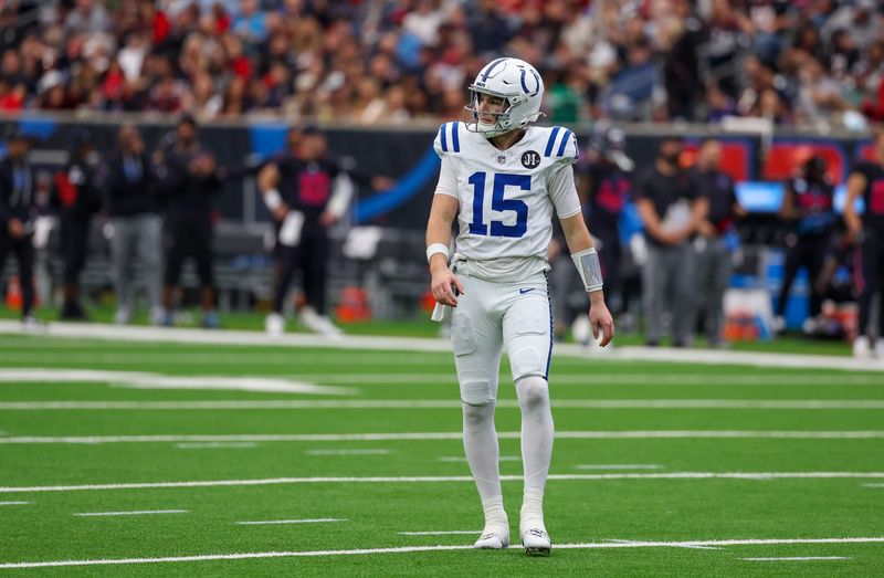 Jan 4, 2026; Houston, Texas, USA; Indianapolis Colts quarterback Riley Leonard (15) after throwing a touchdown pass against the Houston Texans in the first half at NRG Stadium. Mandatory Credit: Thomas Shea-Imagn Images