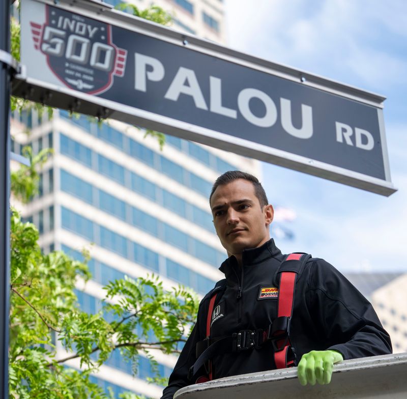 Alex Palou IndyCar driver finishes the installation of his street sign Tuesday, April 21, 2026, in Indianapolis.