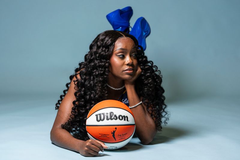 Indiana Fever guard Raven Johnson (3) poses for a photo Wednesday, April 22, 2026, during media day at Gainbridge Fieldhouse in Indianapolis.