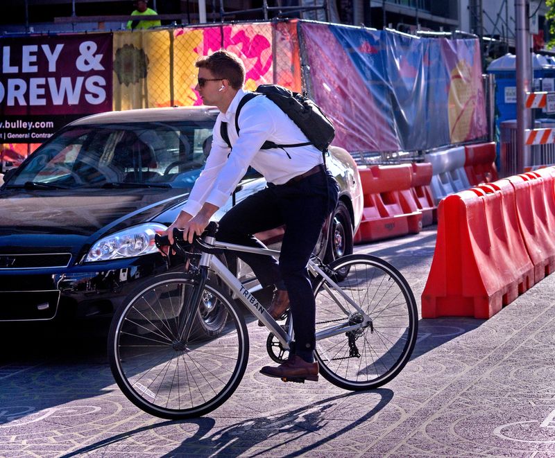 A cyclist dodges construction Thursday, April 23, 2026 in downtown Indianapolis. With gas prices rising, some are taking alternative modes of transportation.