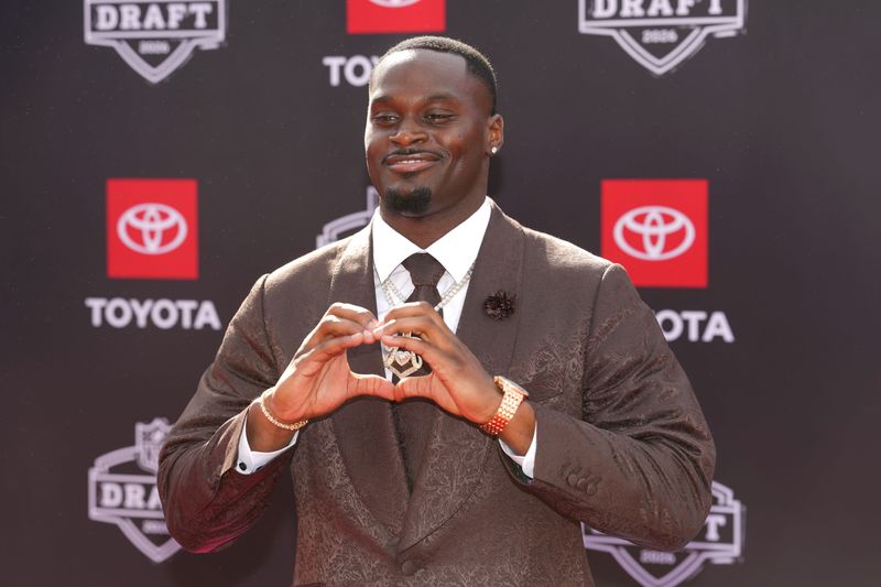 Apr 23, 2026; Pittsburgh, PA, USA; Notre Dame Fighting Irish running back Jeremiyah Love poses on the red carpet before the 2026 NFL Draft at Point State Park. Mandatory Credit: Kirby Lee-Imagn Images