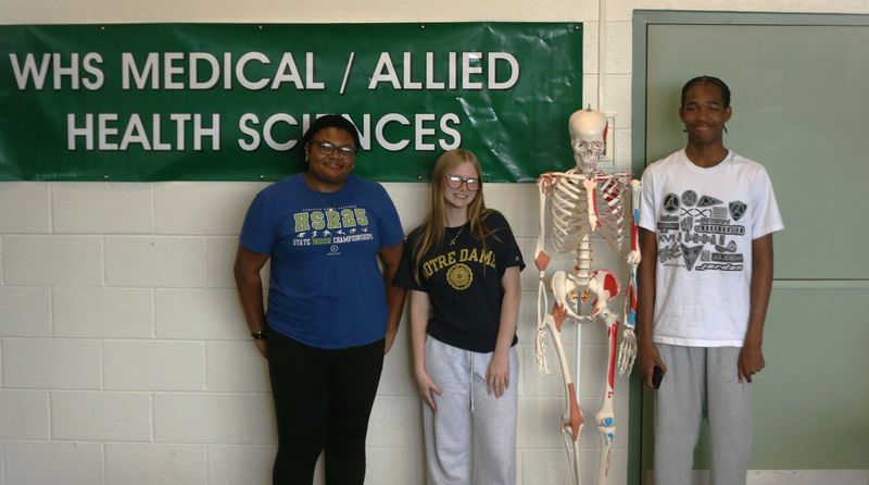 Samara Rouser (left), Evie Gehring (middle) and Brenden Reed (right) pose for a photo during their Certified Nursing Assistant class Thursday, April 23, 2026, at South Bend Washington High School.
