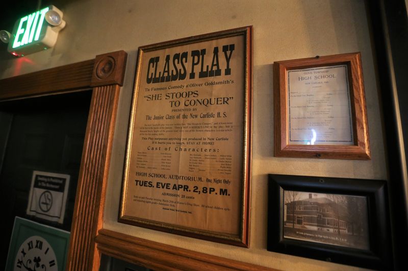 An old play ad for "She Stoops to Conquer," presented by the junior class of New Carlisle High School, hangs in Kate O'Connor's Irish Pub on April 23, 2026, in New Carlisle.