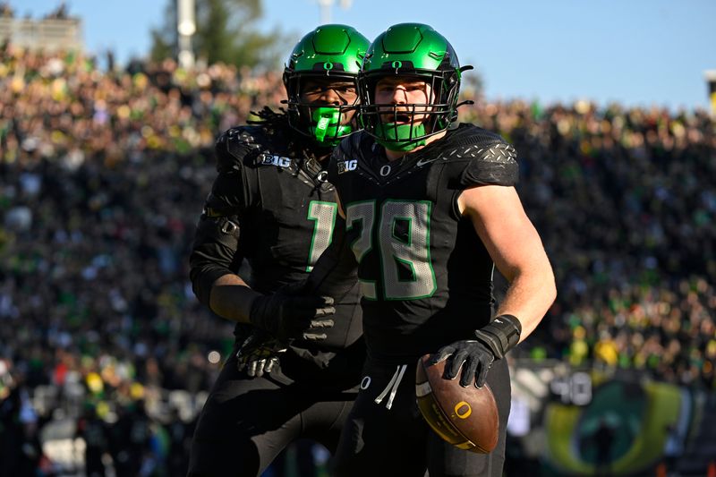 Nov 22, 2025; Eugene, Oregon, USA; Oregon Ducks linebacker Bryce Boettcher (28) celebrates after scoring a touchdown against the Southern California Trojans during the first half at Autzen Stadium. Mandatory Credit: Troy Wayrynen-Imagn Images