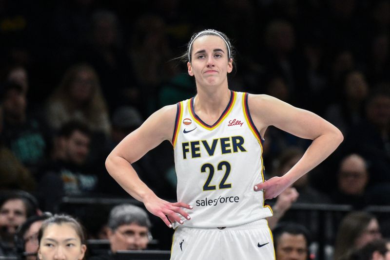 Apr 25, 2026; Brooklyn, NY, USA; Indiana Fever guard Caitlin Clark (22) reacts during the first half against the New York Liberty at Barclays Center. Mandatory Credit: John Jones-Imagn Images