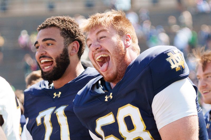 Notre Dame offensive linemen Matty Augustine (58) and Styles Prescod (71) celebrate after the Blue-Gold spring game at Notre Dame Stadium on Saturday, April 25, 2026, in South Bend.