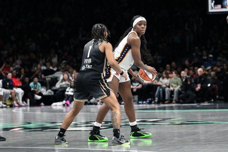 Apr 25, 2026; Brooklyn, NY, USA; Indiana Fever guard Raven Johnson (3) sets the play while defended by New York Liberty guard Ny'ceara Pryor (1) during the first half at Barclays Center. Mandatory Credit: John Jones-Imagn Images