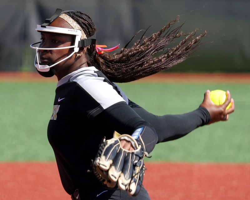 Penn Kingsmen's pitcher Caitlyn Denny (19) throws during a Carmel Invitational game on Saturday, April 25, 2026, at Cherry Tree Softball Complex in Carmel.