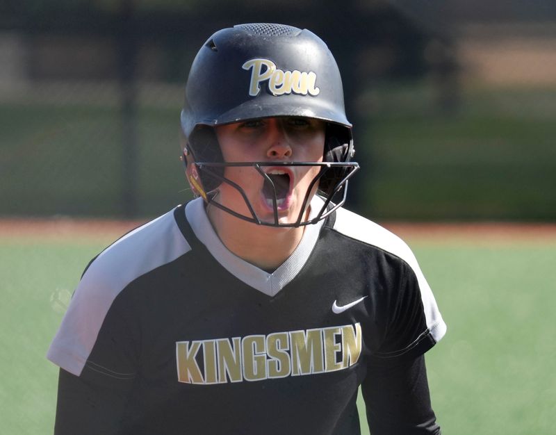 Penn Kingsmen's Phoebe Wood (14) yells to the dugout during a Carmel Invitational game on Saturday, April 25, 2026, at Cherry Tree Softball Complex in Carmel.