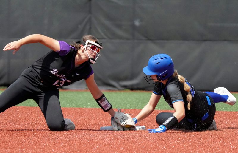 Brownsburg Bulldogs' Delaney McInerney (13) outs Lake Central Indians' Addy Mikolanis (27) at second base during a Carmel Invitational game on Saturday, April 25, 2026, at Cherry Tree Softball Complex in Carmel.