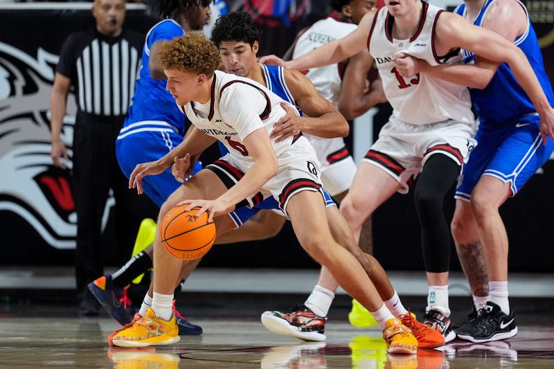 Feb 3, 2026; Davidson, North Carolina, USA; Davidson Wildcats guard Devin Brown (6) works the ball near the basket defended by Saint Louis Billikens guard Dion Brown (13) during the second half at McKillop Court at John M. Belk Arena. Mandatory Credit: Jim Dedmon-Imagn Images