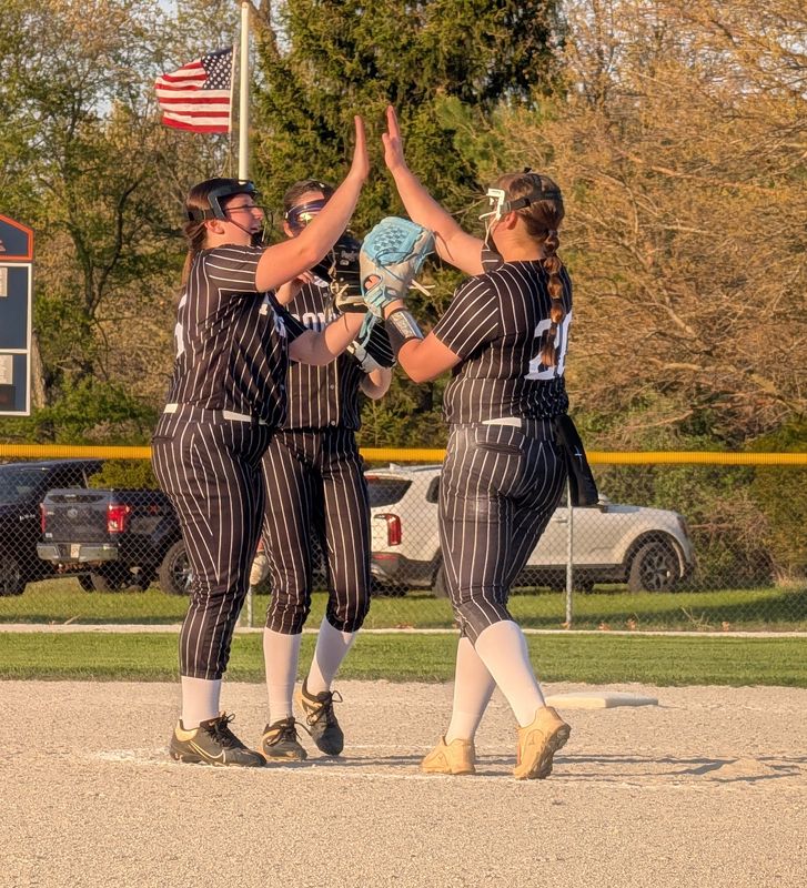 Frontier freshman pitcher Sarah Strapp (right) gets greeted with high fives after recording a strikeout against North Newton on Friday, April 24, 2026.