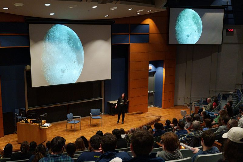 Kelsey Young, the Artemis II Lunar Science lead and Artemis Science Flight Operations lead for NASA, shares photos of the moon taken during the Artemis II mission while speaking at DeBartolo Hall at the University of Notre Dame on Tuesday, April 28, 2026, in South Bend.