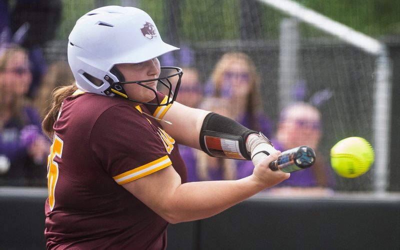 North's Kaydence Silvers (26) hits during the Bloomington North versus Bloomington South girl's softball game at Bloomington High School South on Tuesday, April 28, 2026.