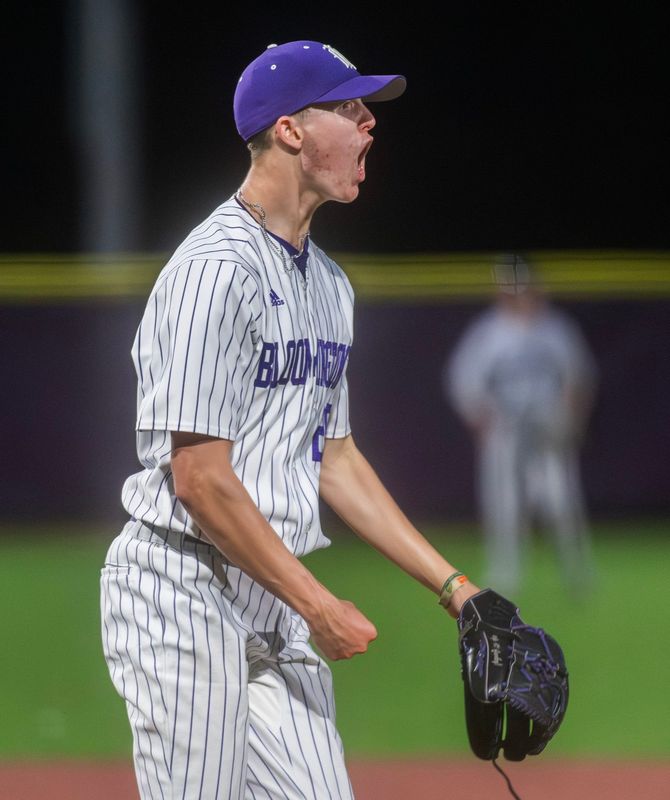 South's Xavier Hemingway (26) celebrates his shutout during the Bloomington North versus Bloomington South boy's baseball game at Bloomington High School South on Tuesday, April 28, 2026.