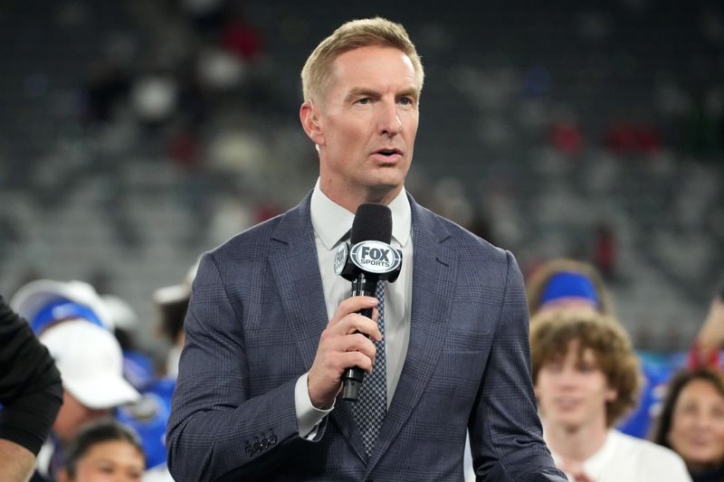Jan 2, 2026; San Diego, CA, USA; Fox Sports broadcaster Joel Klatt emcees the Holiday Bowl trophy presentation at Snapdragon Stadium. Mandatory Credit: Kirby Lee-Imagn Images